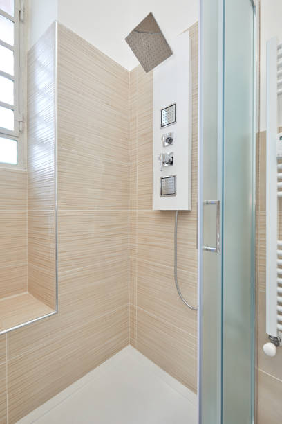 istock Shower interior with shower column in renovated apartment 1163982596