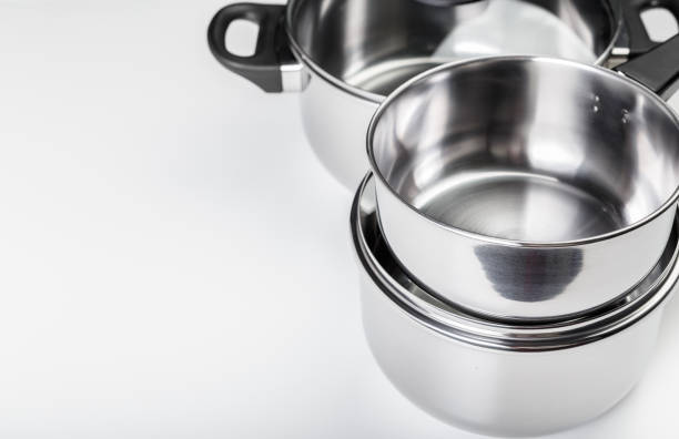 istock Stainless steel pots and pans isolated on white 1163983415