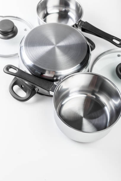 istock Stainless steel pots and pans isolated on white 1163983614