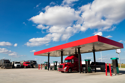 Semi truck at truck stop gas pump, American transport concept, Missouri, United States.
