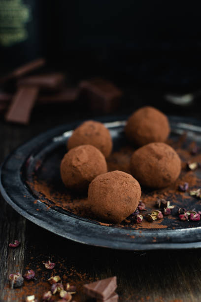 istock dark chocolate candy truffles with sichuan pepper on dark background 1163984996