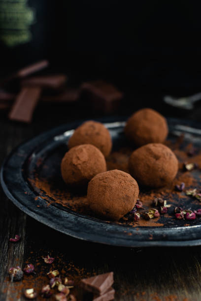 istock dark chocolate candy truffles with sichuan pepper on dark background 1163985127