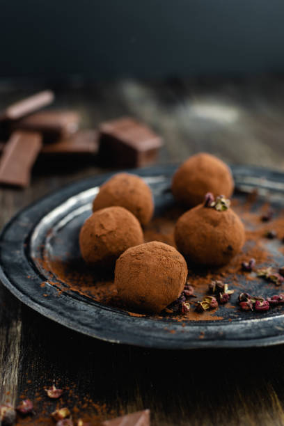 istock dark chocolate candy truffles with sichuan pepper on dark background 1163985197