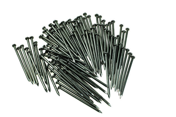 istock Pile of iron nails at white background 1163986405