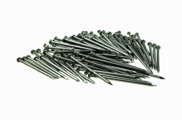 istock Pile of iron nails at white background 1163986407
