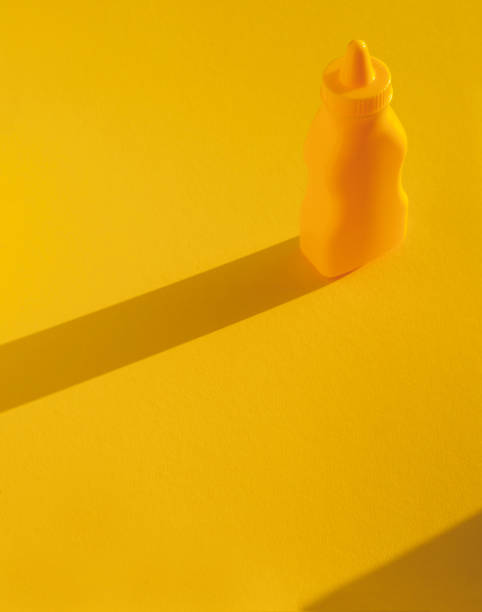 istock Mustard, Mayonnaise bottles with plastic corns and spoon. Culinary concept. Copyspace included. 1163987674