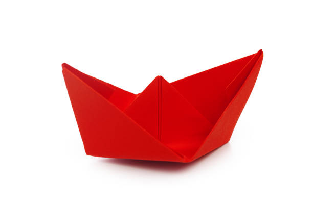 istock origami paper boat isolated on white background 1163989058