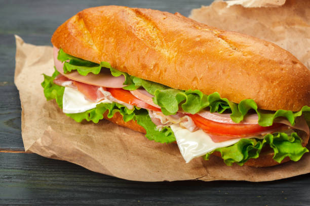 istock sandwich on a wooden table 1163989847
