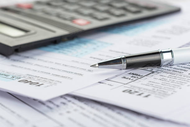 tax forms, close up - tax tax form refund financial advisor imagens e fotografias de stock