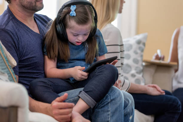 istock Little girl watches something on digital tablet 1163992022