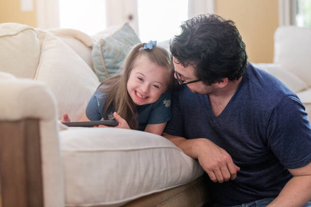 istock Happy little girl has fun with her dad 1163992033