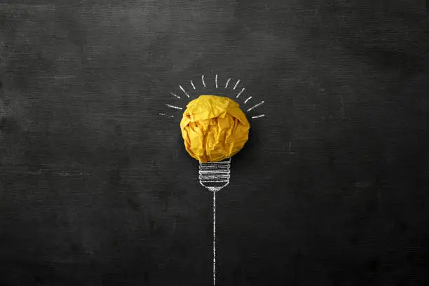 Photo of Idea Concept Light Bulb Crumpled Paper