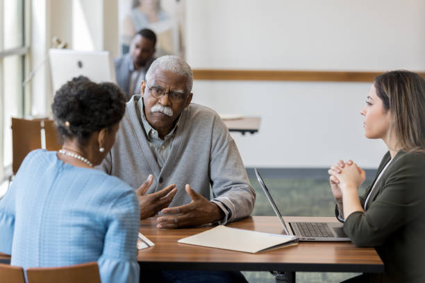 istock Business owners discuss possible expansion while assistant looks on 1163992160