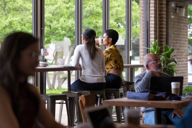 Tokyo/Japan - November 16, 2019: Starbucks in Shinjuku district. Young people are seen studying, readying and drinking coffee.