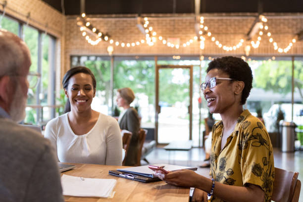 istock Business colleagues share a laugh together 1163992300
