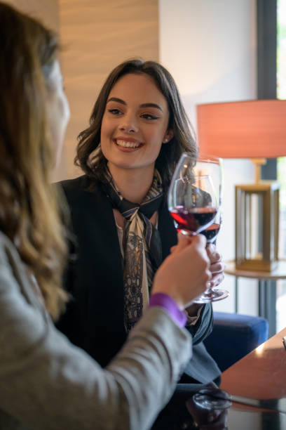 istock Businesswomen toasting with wine 1163992636