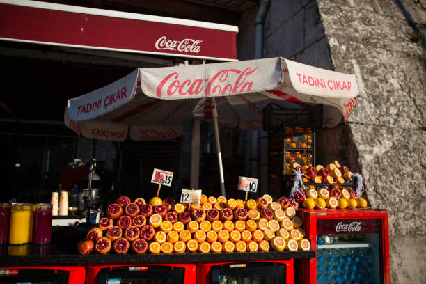 Turkey, Istanbul - May 4, 2019: Oranges and pomegranates are sold on the street of the city. You can drink fresh juice at every step