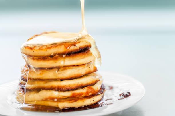istock pancakes, spread with honey 1163994187
