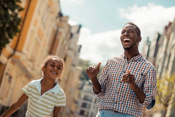istock Delighted young man laughing at funny story 1163999369