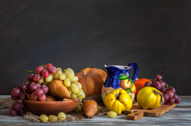istock Still life in a rustic style. Autumn collection. Harvest. Colorful pitcher. 1164000086