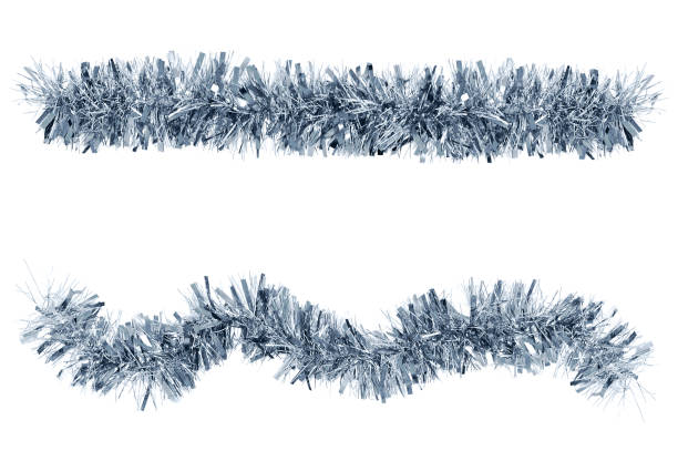 Two Christmas tinsel silver color for decoration. White isolate Two Christmas tinsel silver color for decoration. White isolate tinsel stock pictures, royalty-free photos & images