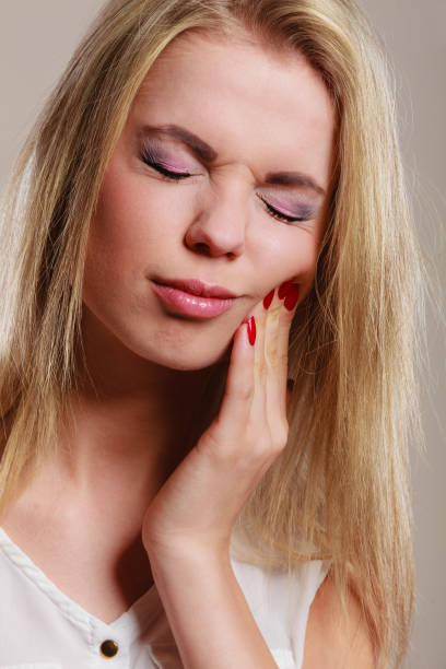 istock Toothache. woman suffering from tooth pain 1164002224