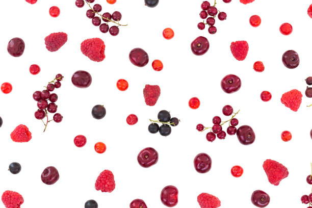 istock Berry patterns, flat laying. Cherry, black currant and red currant isolated on white background. Creative concept of scattered berries 1164002311