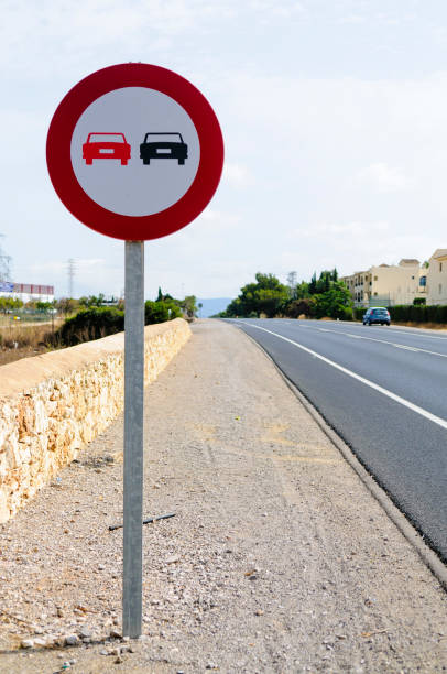 istock Spanish no overtaking road sign 1164003759