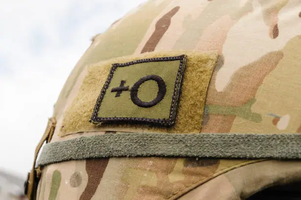 Photo of Blood group indicator patch on a soldier's helmet