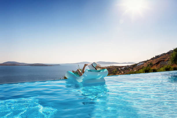 istock Woman relaxes on a float under the Mediterranean sun 1164005532