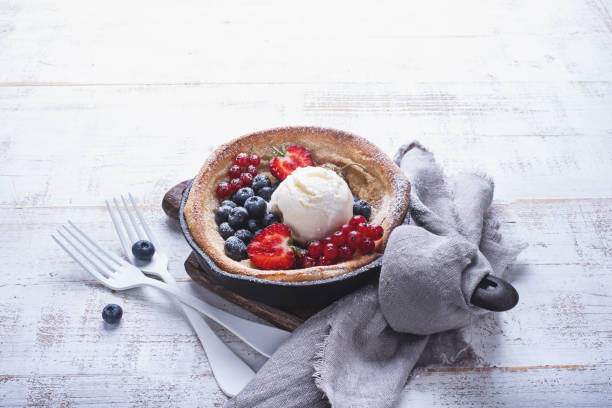 Dutch baby with berries stock photo