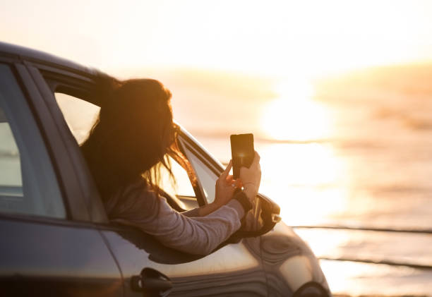istock Capturing the sunrise in her phone 1164007258