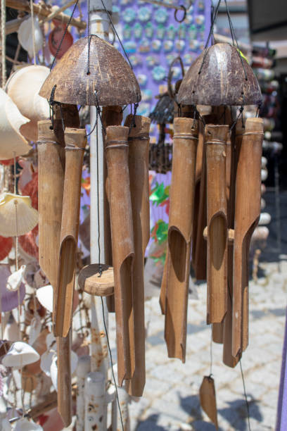 istock Hanging wooden wind bell. Close-up. Blurred background. 1164008825