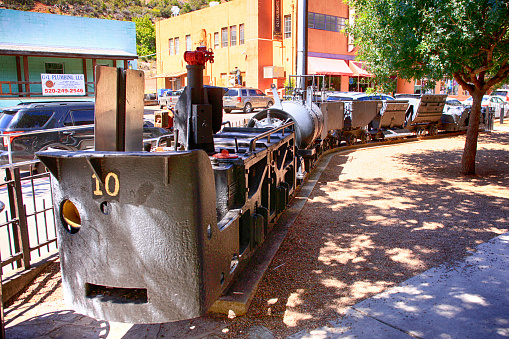 Narrow guage mining locomotive and wagons on display outside the mining museum in historic Bisbee, AZ