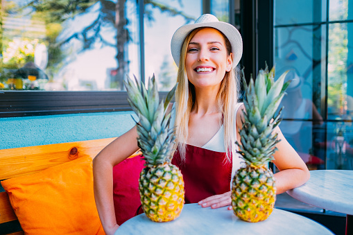 Cute Woman Holding Pineapple
