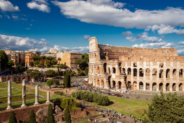 istock Colosseum with clear blue sky and clouds, Rome 1164016436