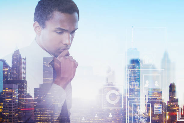 istock Pensive African man in city, digital interface 1164017036