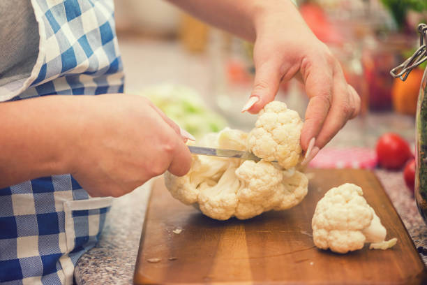 Preserving Cauliflower, Carrots and Garlic in a Jars stock photo