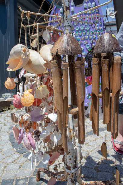 istock Hanging wooden wind bell. Close-up. Blurred background. 1164018500