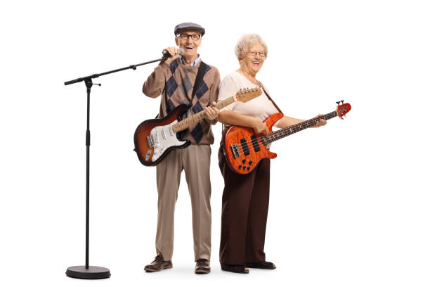 istock Senior musicians with electric guitar and a microphone 1164019151