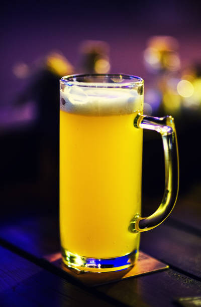 istock Glass of light beer on a pub background. 1164019295