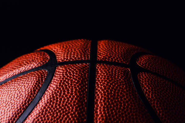 istock basketball ball on black background. 1164019298