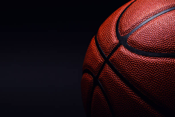 istock basketball ball on black background. 1164019302