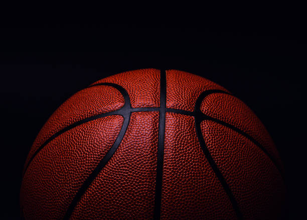 istock basketball ball on black background. 1164019306