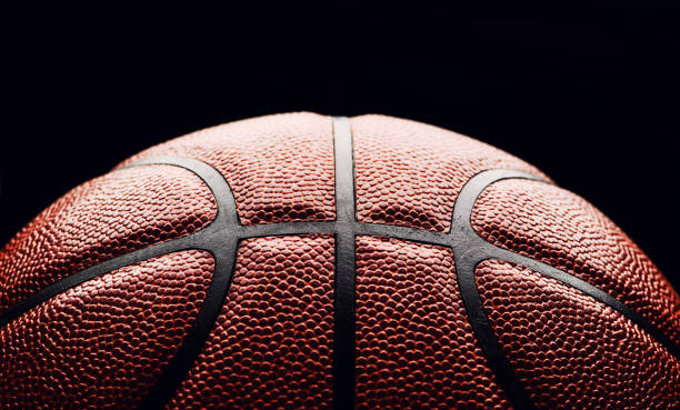 istock basketball ball on black background. 1164019317