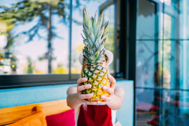 Cute Woman Holding Pineapple
