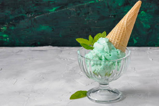 a cone of pistachio or mint ice cream stock photo