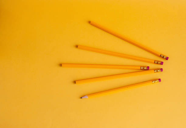 istock Bright yellow pencils for study, drawing, a hobby on a yellow background. 1164021873