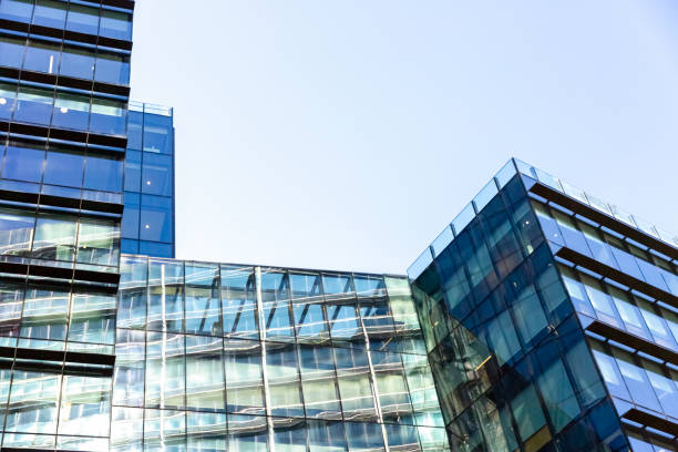 istock Low angle view of office buildings, background with copy space 1164022625