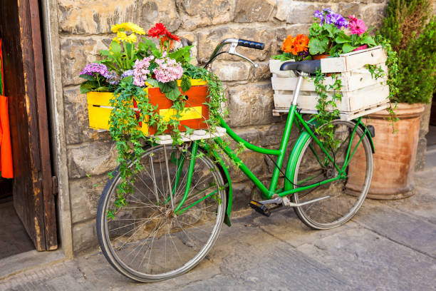 istock Green bicycle decorated with flowers parked in Florence 1164026408